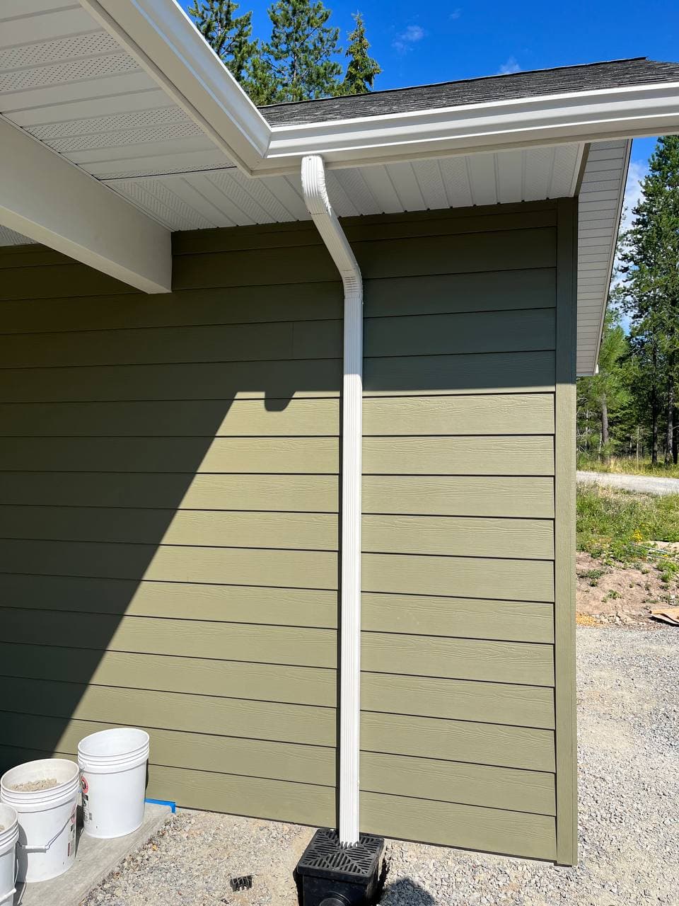 Seamless gutter installation on residential roofline