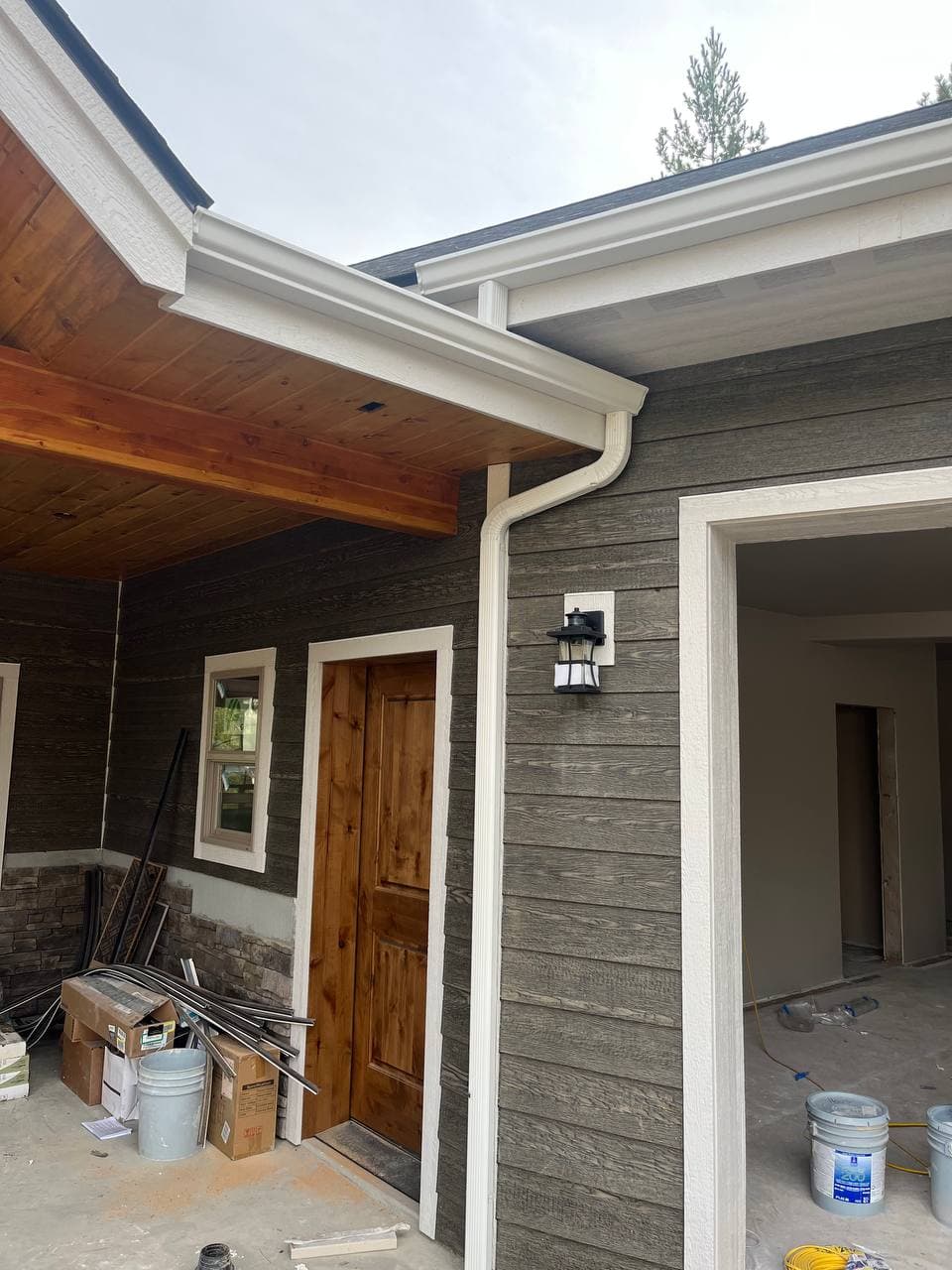 Gutter and downspout installation on home exterior