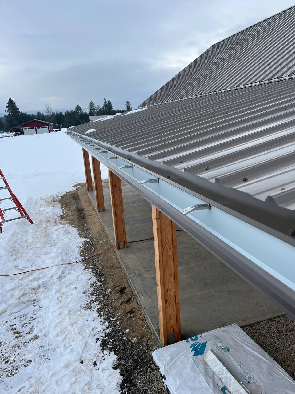 Seamless gutter installation on residential exterior