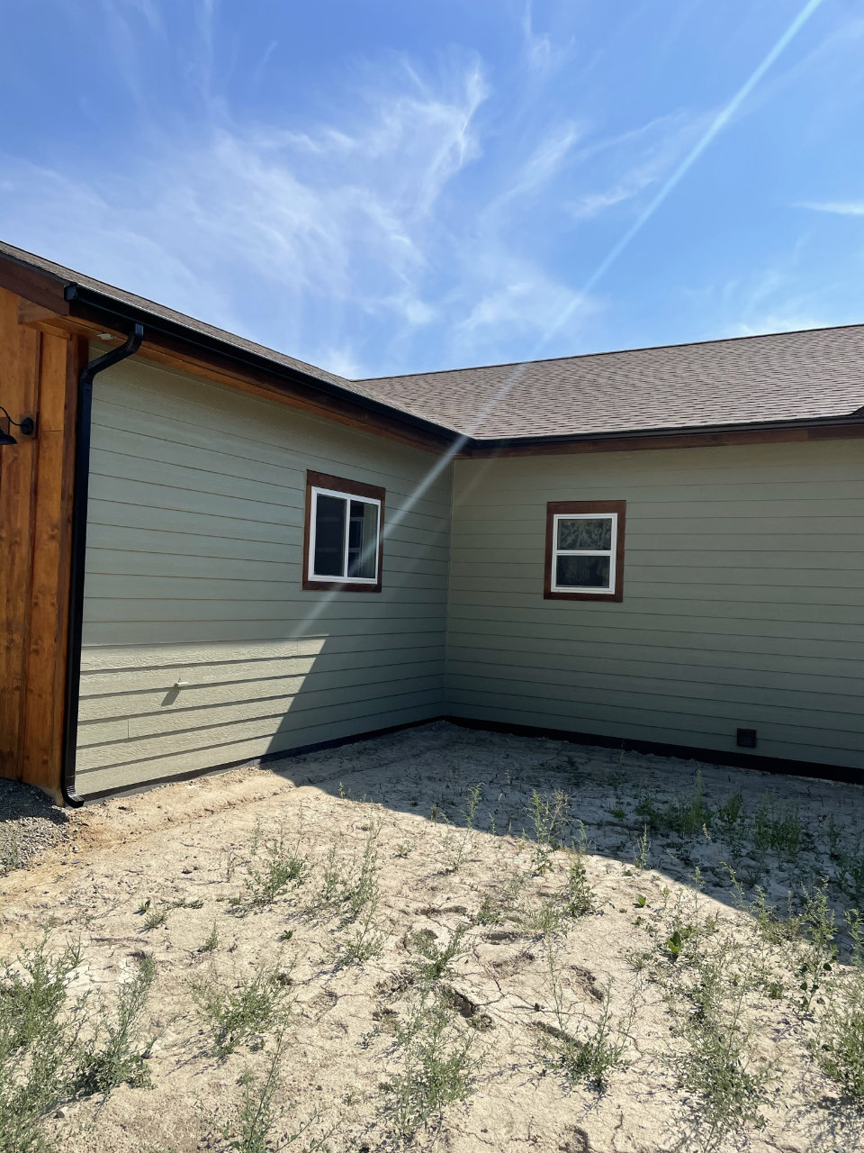 White seamless gutter installation on home exterior