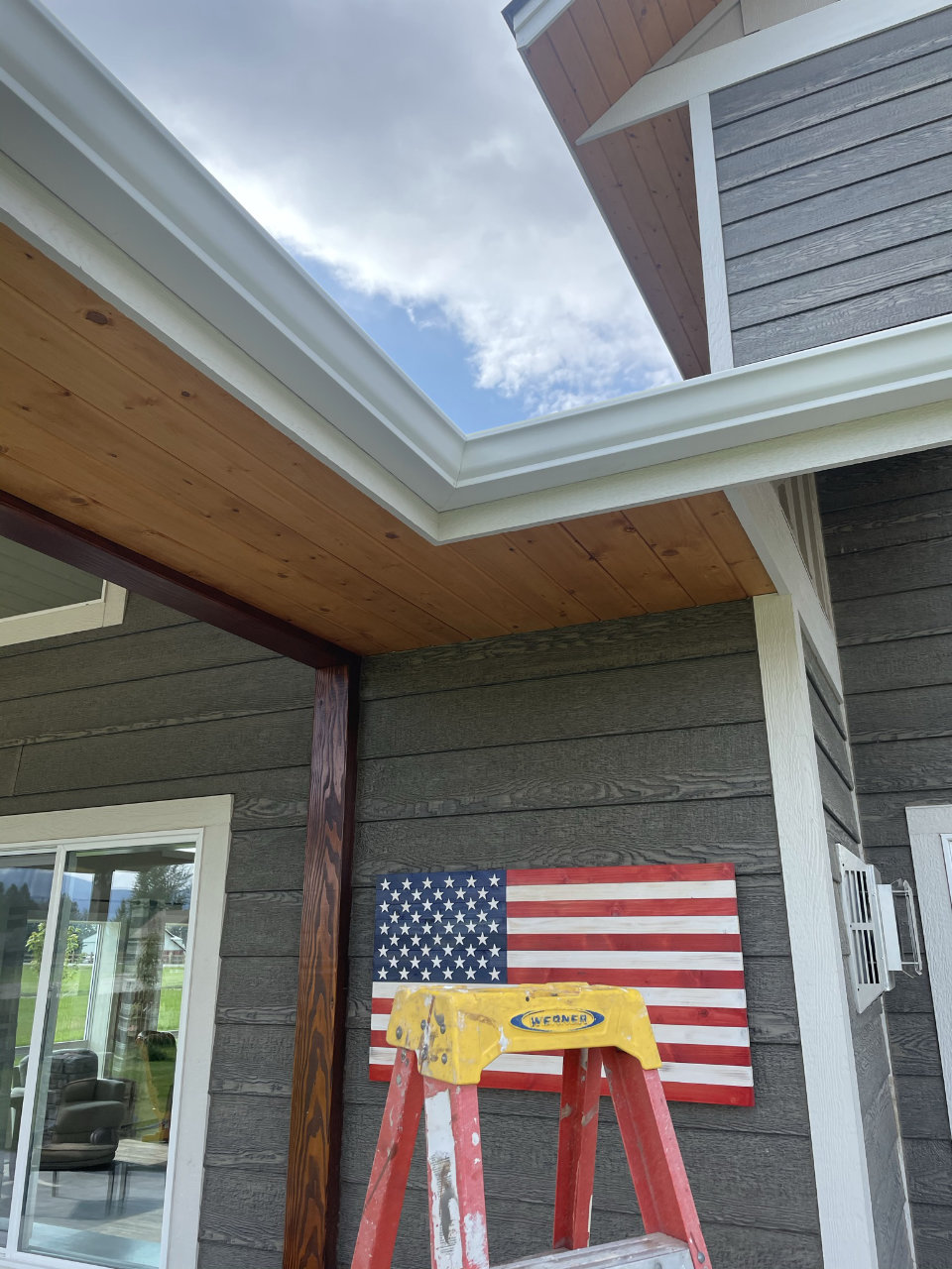 Roof edge with gutter system showing fascia and drainage line