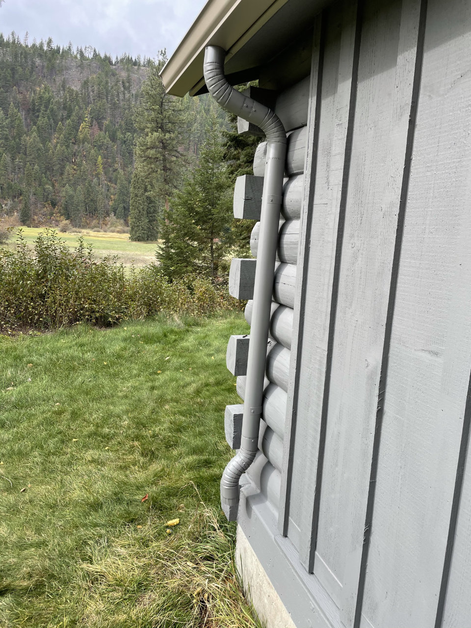 Residential gutter installation with downspouts