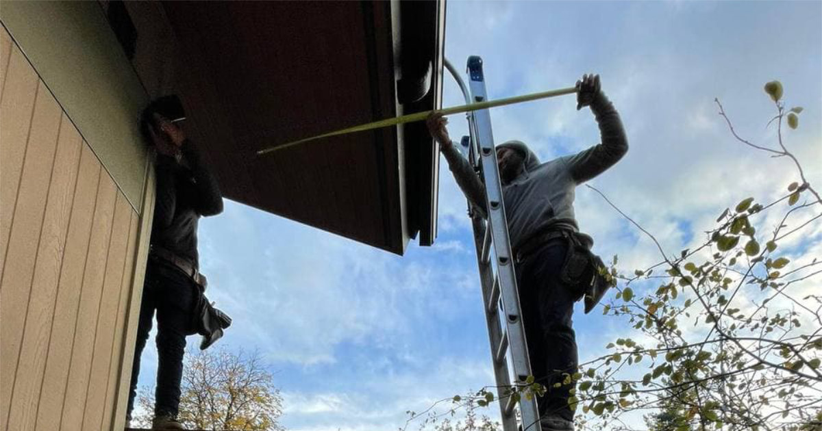 Gutter technician performing gutter repair